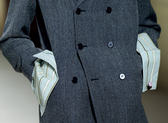 Prada’s intentionally dirty cuﬀs as seen at Milan Fashion Week AW2026.