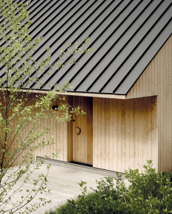 The cottage’s exterior cedar cladding was chosen for the way in which it will patinate over time.
