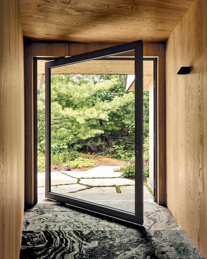 Architect Adam Robinson and designer Thom Fougere floored this entrance in flamed Eramosa stone.