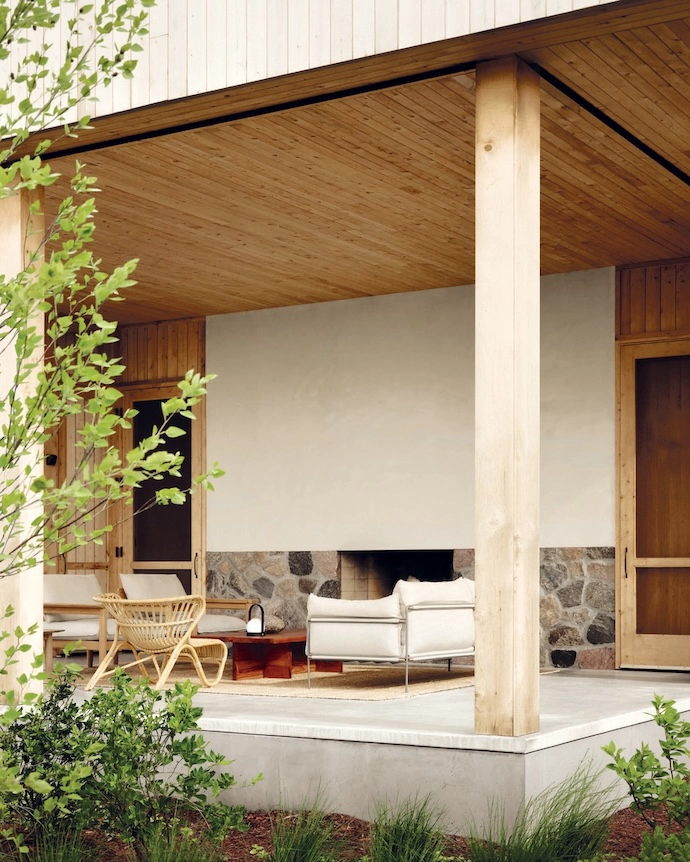 A double-sided fireplace warms the sheltered porch.