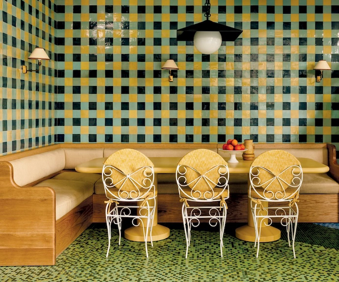 The interiors of Wilde Lisbon in Portugal prove that texture is king. At the heart of the hotel, the bar and lounge feature marble, plush seating, tastefully gathered curtains, and an abundance of colour. Traditional touches are playfully subverted and iconic tile patterns reimagined – for example in the interior courtyard, where blue chequered floors are paired with wood furniture.