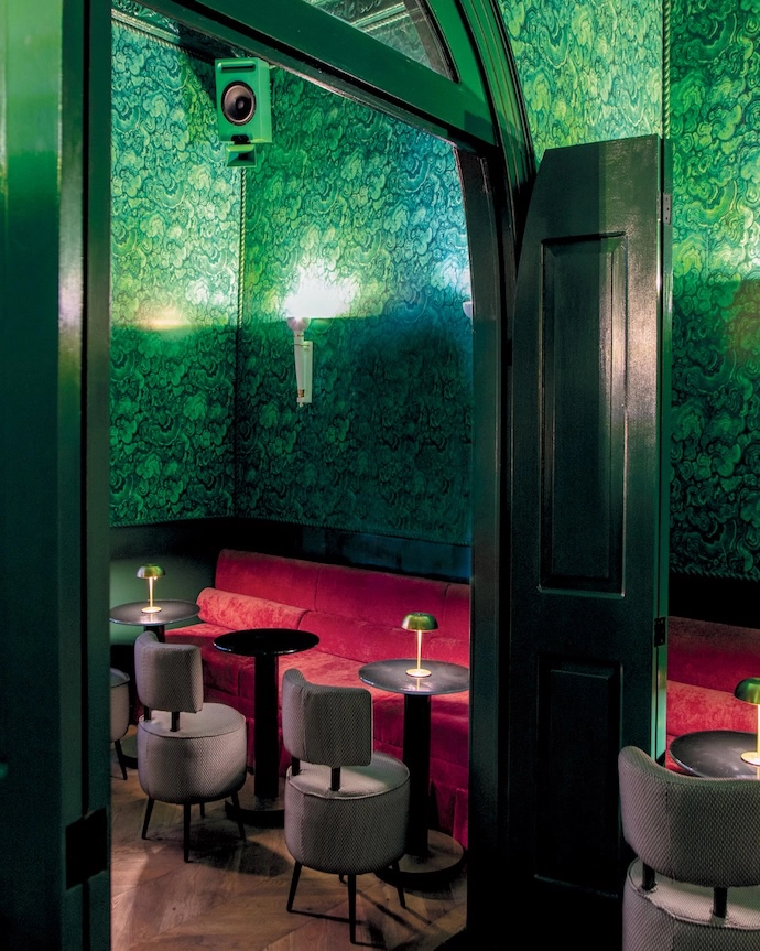 Deep green patterned wallpaper and a velvet banquette capture the esoteric spirit conceived by Stephanie’s brother, Alejandro Barba Mendoza, and brought to life in the interiors by Stephanie.