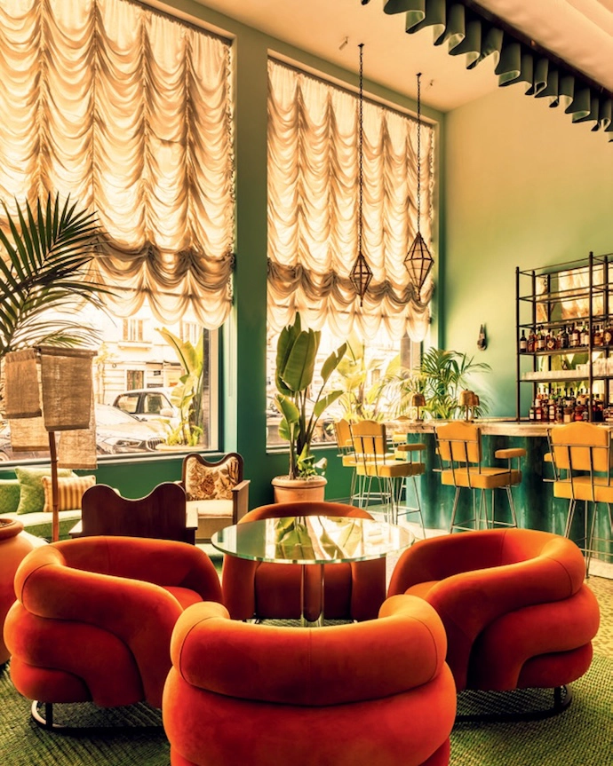 The interiors of Wilde Lisbon in Portugal prove that texture is king. At the heart of the hotel, the bar and lounge feature marble, plush seating, tastefully gathered curtains, and an abundance of colour. Traditional touches are playfully subverted and iconic tile patterns reimagined – for example in the interior courtyard, where blue chequered floors are paired with wood furniture.