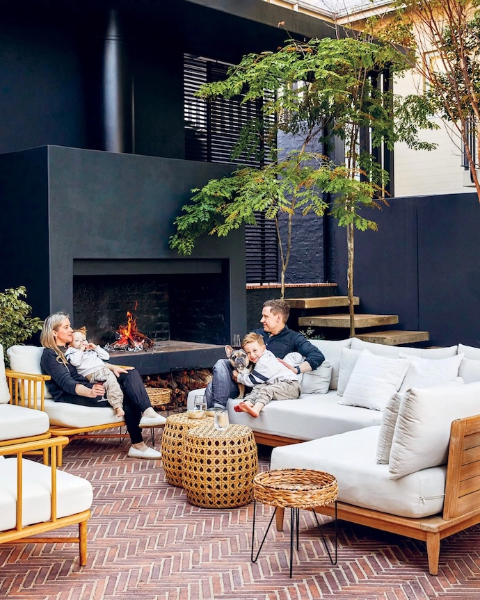 The family enjoys spending quality time on the covered outdoor patio.