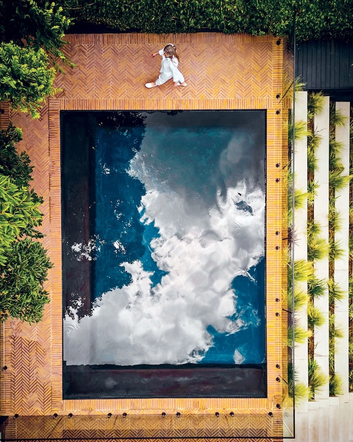 An essential in Joburg summers, the swimming pool is edged in the same classic klompie brick pavers from Revelstone as the rest of the outdoor space.