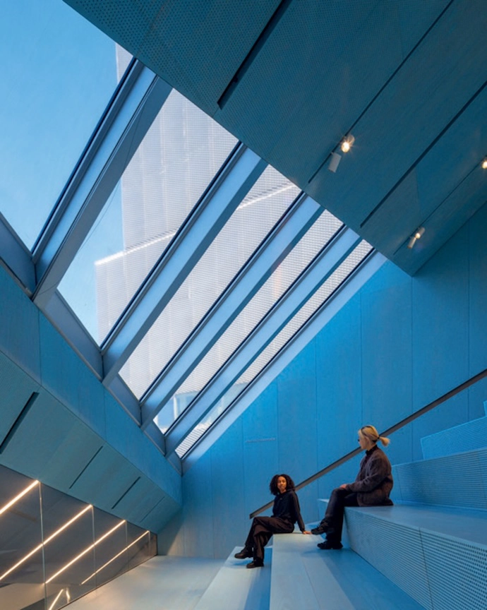 OMA’s extension to New Museum sits adjacent to SANAA’s 2007 building. In architectural dialogue with the original, the extension expands the relationship between indoors and out, oft en through triangular apertures.