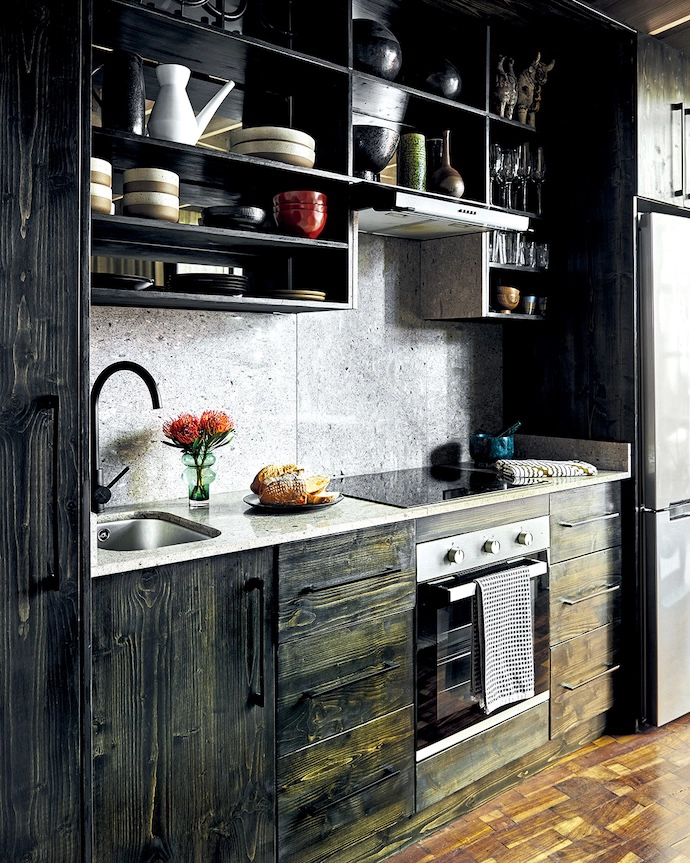The kitchen was originally in the narrowest end of the studio, but as Jonty says, “It never made sense there.” Moving it to the broadest part of the plan gave the room a natural flow. He kept the island pared back, using the same timber seen elsewhere to make it feel built in.