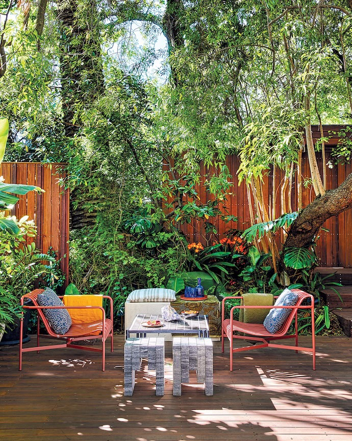The courtyard chairs are from Poetry, while the stone stools and tiled steel table were designed by Jonty. 