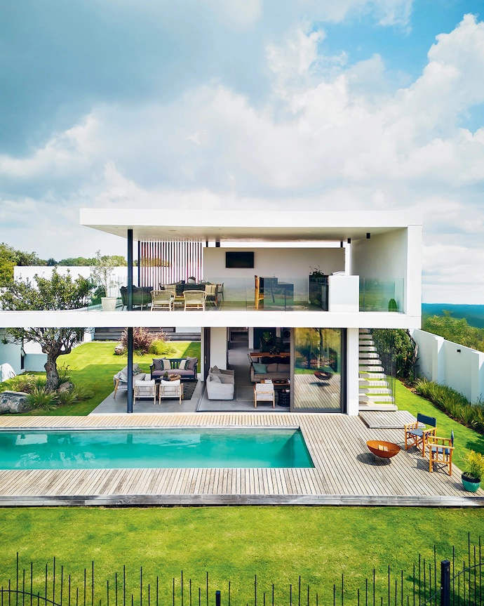A singular architectural gesture strikes a quiet pose from the golf course and nature reserve side.