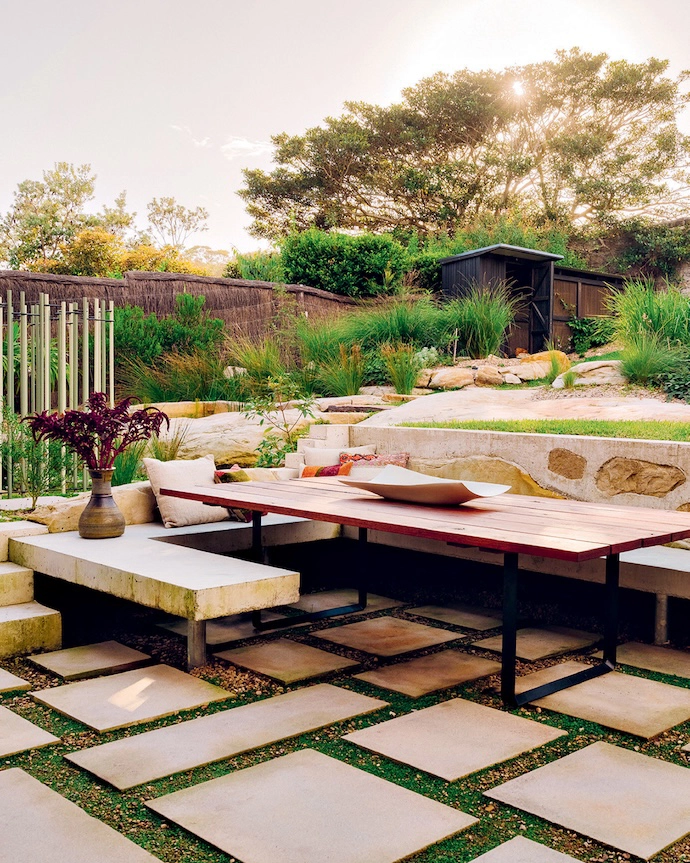 Outdoor living seamlessly merges with a fruit, herb and vegetable garden in which chickens roam freely.