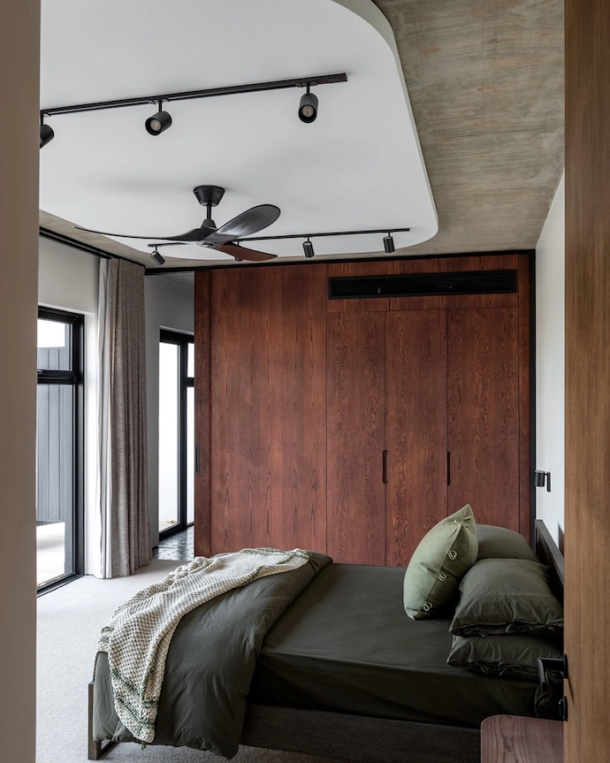 The cabinetry in the bedrooms again functions as a room divider.