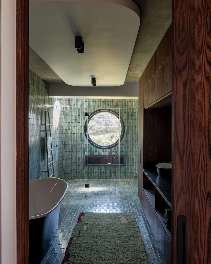 Several bathrooms feature mohair rugs by Frances van Hasselt.